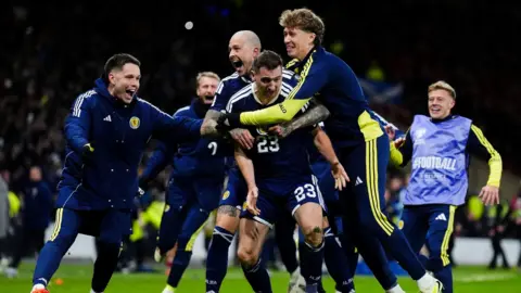 PA Media Scotland players celebrate Kenny McLean scoring the team's fourth goal during the Fifa World Cup European Qualifying match at Hampden Park, Glasgow, in November.