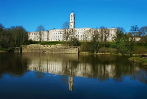 Getty A white building overlooking a lake