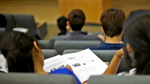 Students working in a lecture theatre