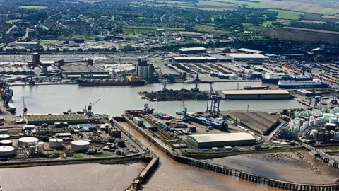 Aerial view of Immingham with the docks in the foreground and houses and other buildings in the background