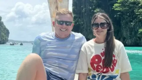 Supplied A picture of Tommy Hunter next to Chloe Mefford on a holiday next to the sea