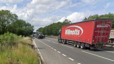 The A34 northbound near Oxford, with a red lorry in the foreground