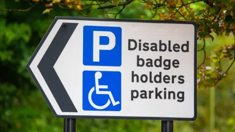 Close-up of a Disabled Badge Holders Parking sign in the UK.
