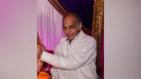 Supplied Bhim Kohli, wearing a white jumper, smiling