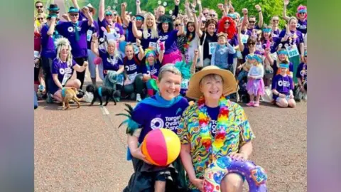 Christine Campbell Christine Campbell pictured with some of the people involved in a walk at Stormont last month to raise awareness of ovarian cancer