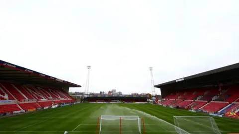 Getty Images The pitch at Swindon Town's County Ground. The stands are left and right of the pitch, with the goal centre of the image.