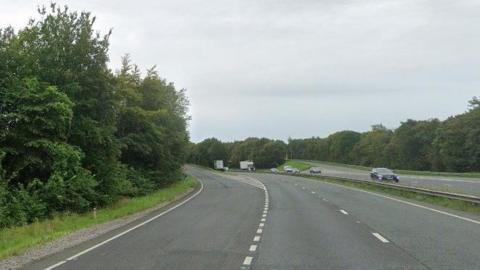 Cars on the A483 motorway at the A525 Ruthin Road slippway 