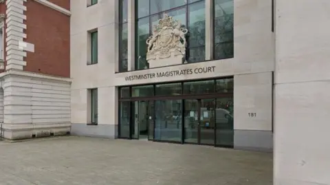 General view of the sign and crest above the entrance to Westminster Magistrates' Court.