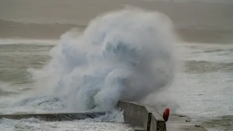 Stephen Henderson Large wave hitting against a wall in Portrush