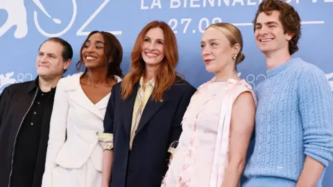 Getty Images Michael Stuhlbarg, Ayo Edebiri, Julia Roberts, Chloë Sevigny and Andrew Garfield attend the
