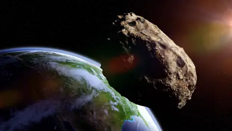 Getty Images Illustration showing meteorite close to planet Earth