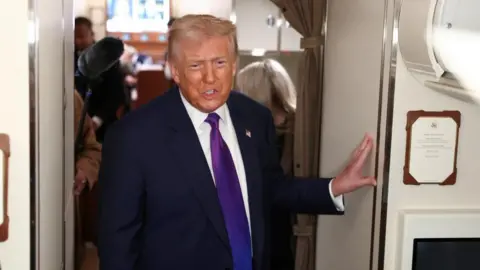 Donald Trump standing in Air Force One