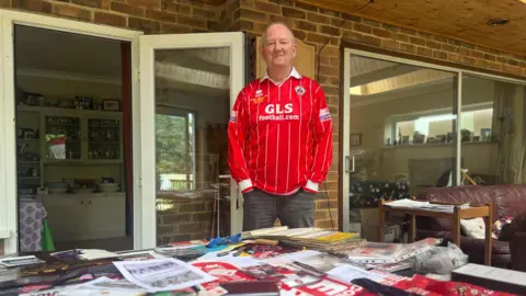 BBC/James Dunn Mick Fox at home in Crawley with his huge collection of memorabilia 