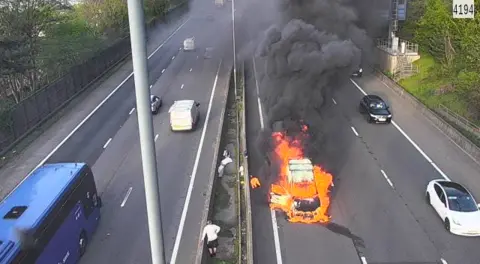 M4 fire Van in flames causing long Newport Cardiff queues