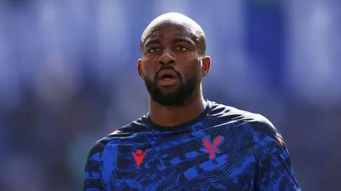 Jean-Philippe Mateta warming up for Crystal Palace