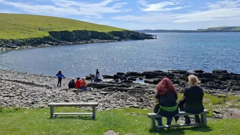 BBC Weather watchers: Wendy House two people sitting on a bench and  