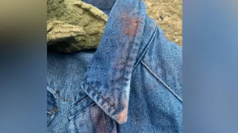 Anna Tennant Red dust that has been placed on an outfit from the Toxic Town show