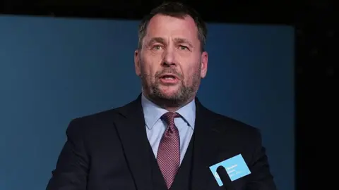 PA Media Stephen Atkinson speaks during a Reform UK press conference at Royal Horseguards Hotel in London