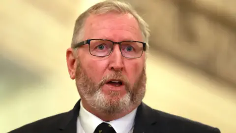 PA Media Doug Beattie, he has light hair and beard and glasses.