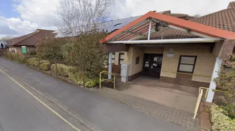 Street view of the entrance and outside of the former Community Resource Centre, in Comet Way, Coalville, Leicestershire.