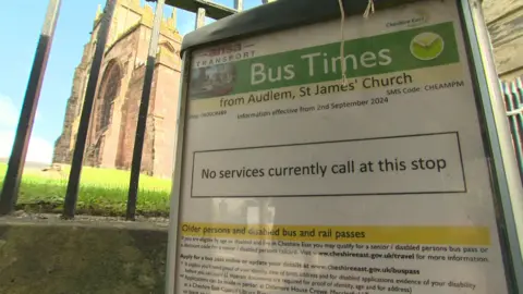 A view of the bus times board at the bus stop in Audlem, saying that no services currently call at the stop.