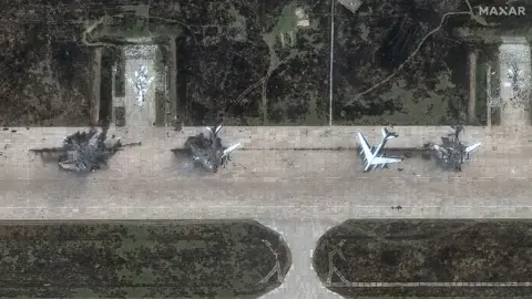 Maxar Technologies A satellite view shows four military aircraft, at least three looking destroyed, at the Belaya air base, near Stepnoy, Irkutsk region, Russia