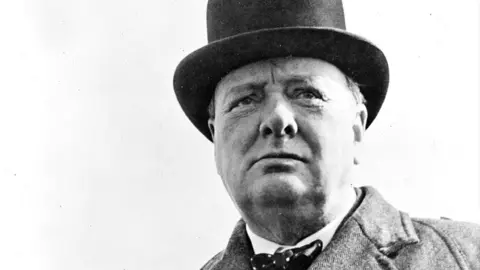 A black-and-white photo of Winston Churchill as British wartime prime minister 1941