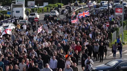 PA A large crowd of people during a protest near Southampton police station. 
