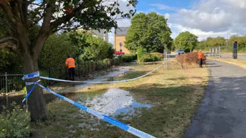 Crews working on the burst water main in Patchway, on the outskirts of Bristol.