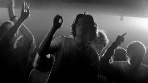 Getty Images Ravers on the dancefloor at the Hacienda in Manchester 1989
