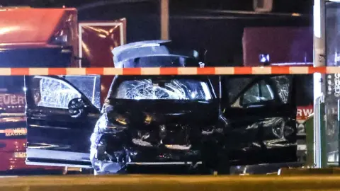 A damaged car at the scene after a car was driven into a crowd in Madgeburg