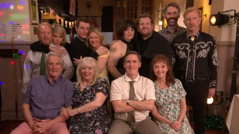 The main cast members from Gavin and Stacey are seen smiling at the camera