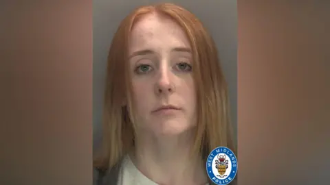 West Midlands Police A mug shot of Kimberley Cookson who has strawberry blonde hair