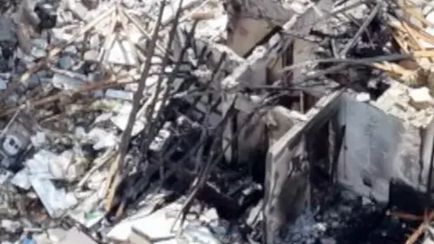 Ruins of bungalow explosion.