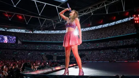 Getty Images Taylor Swift performing at Wembley Stadium in June