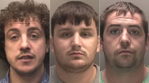 Merseyside Police Custody photographs of Michael Smith who has short curly hair and is wearing a patterned shirt, Adam Williams who has short hair and is wearing a grey t-shirt, and Connor Walsh has short hair and is wearing a green t-shirt.