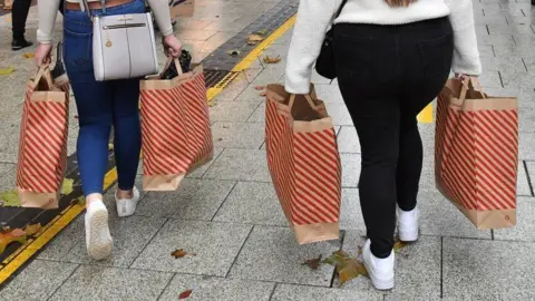 People carrying shopping bags