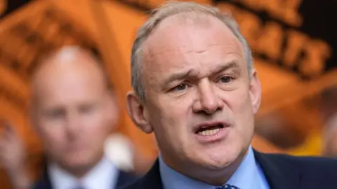 PA Media Liberal Democrat leader Sir Ed Davey makes a speech during a visit to the town centre in Cheltenham, Gloucestershire, while on the General Election campaign trail. Picture date: Thursday May 23, 2024