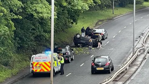 A car has flipped onto its roof on the Clydeside Expressway