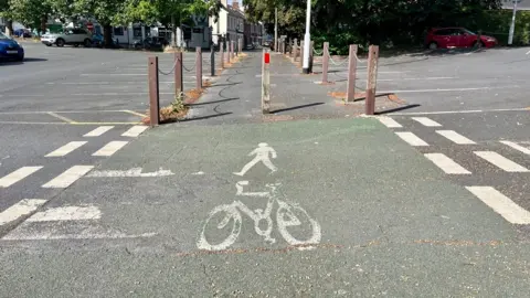 An imag showing a pedestrian and a bicycle to show a shared use path in Newtown, Exeter