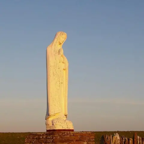 David Bremner/ Geograph A statue of the Virgin Mary in the evening sun light