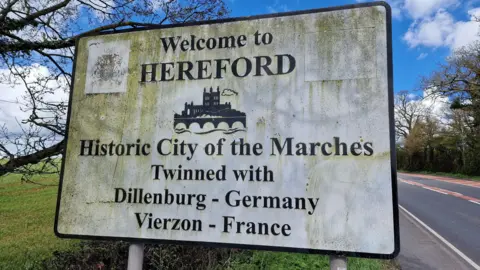 Giles Stokes Dirty A49 road sign