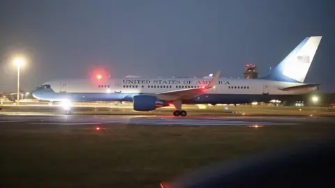 Stephen Huntley/HVC A C-32A with the words 'United States of America' on the runway at RAF Mildenhall in the evening