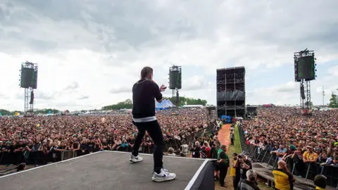 Getty Images A view from the stage as Brent Smith of Shinedown performs to the crowds at Download Festival at Donington Park