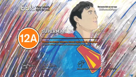 Superman, drawn in his iconic blue, red, and yellow costumer. He is emerging from a background of multicoloured streaks. The word 'Superman' and an orange circle around the digits '12A' overlays the design.
