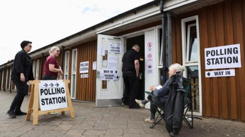 People at a polling station in Tiverton and Honiton in 2022