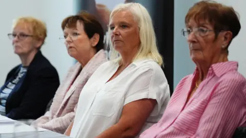 PA Media From left to right: Arelene Fraser's mother Isabelle Thompson; Arlene's sister Carol Gillies; Suzanne Pilley's sister Gail Fairgrieve; and Suzanne's mother Sylvia Pilley at a press conference at Victim Support Scotland in Glasgow