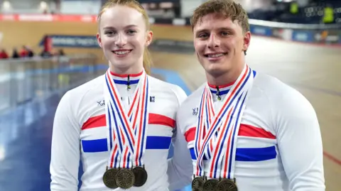 Lauren Bell and Matthew Richardson with their three medals