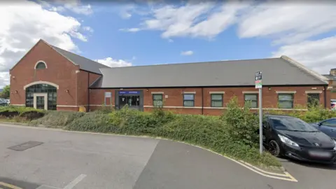 The Lagan Surgery. It is a red-brick building with a grey roof.