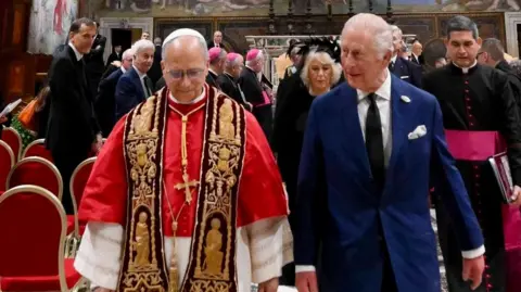 King Charles III and Pope Leo XIV walking together after an ecumenical service at the Sistine Chapel in Vatican City, during the state visit to the Holy See.